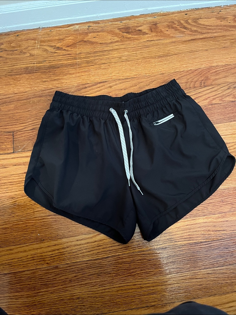 Black Vuori running shorts